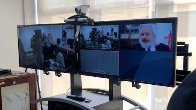Julian Assange appears in court via videolink