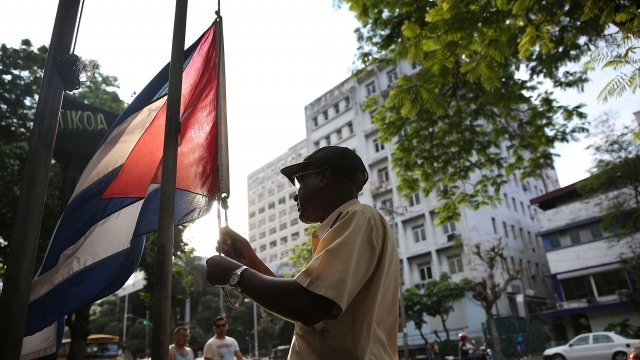 Man holds a Cuban flag