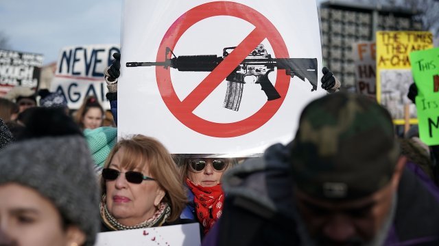 Anti-gun protester holds a sign