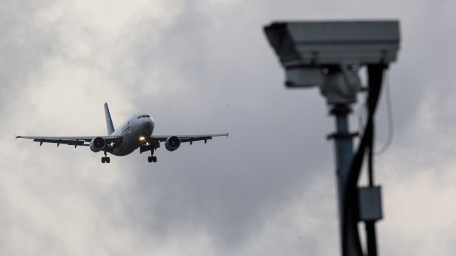 A plane comes in to land at Gatwick Airport's runway