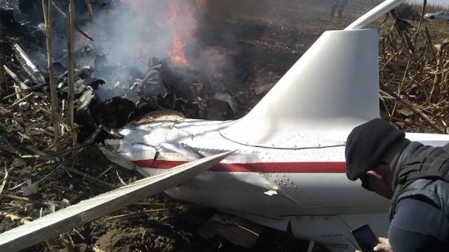 The smoldering remains of a helicopter crash