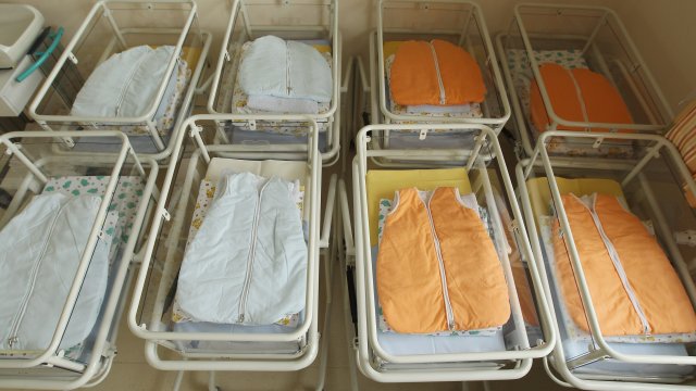 Empty baby beds in a maternity ward of a hospital