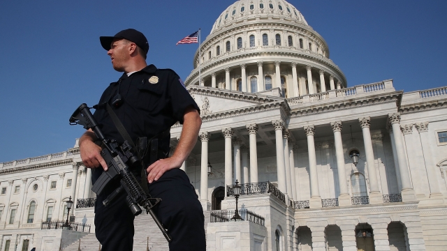 U.S. Capitol police officer stands in front of Capitol Building