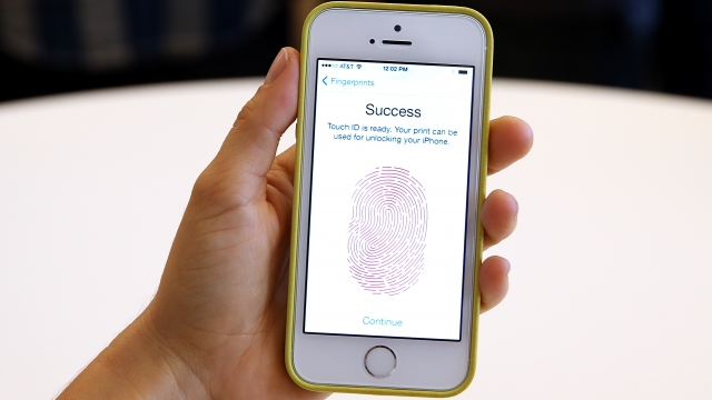 A person sets up a biometric lock on their phone