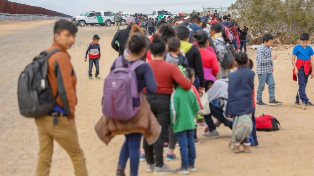 Migrants being processed by Customs and Border Protection