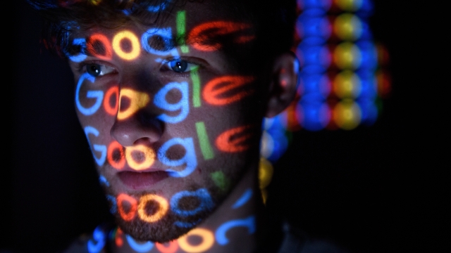 Google logo projected on a person's face