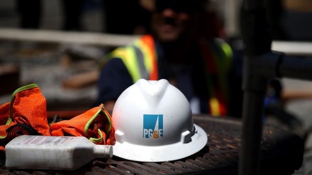 A Pacific Gas and Electric hard hat at a work site.