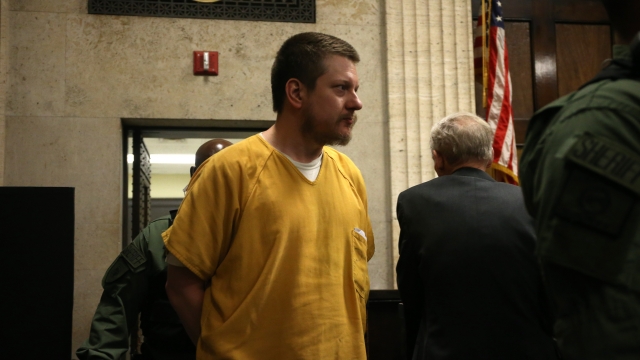 Former Chicago police Officer Jason Van Dyke walks into the courtroom