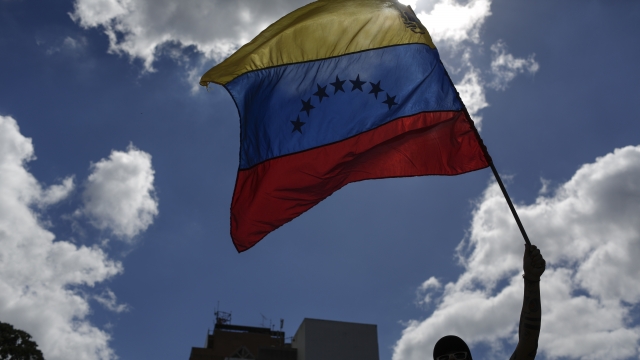 A man waves the Venezuelan flag