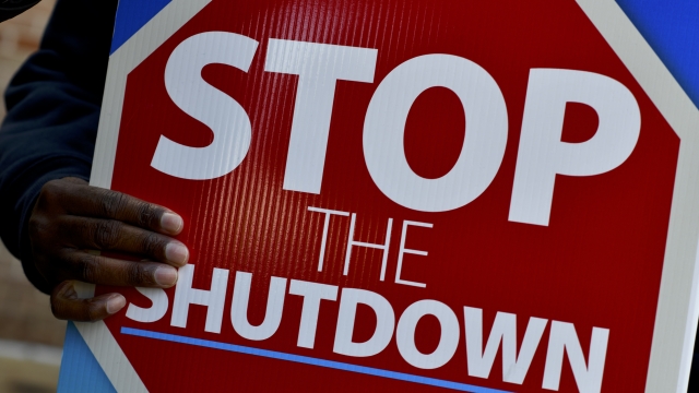 A "stop the shutdown" sign