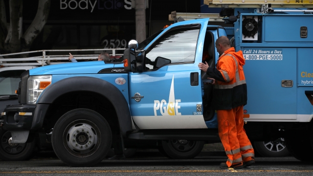 The Pacific Gas & Electric (PG&E) logo is displayed on a PG&E truck