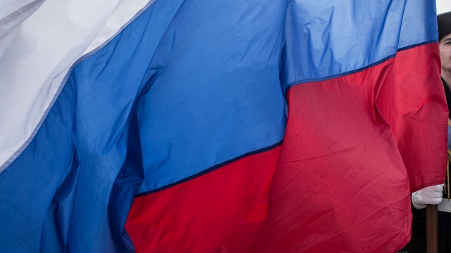 Man holds Russian flag