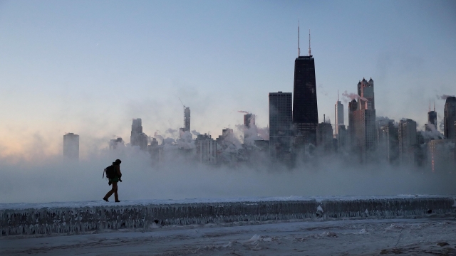 A man walks on ice near Lake Michigan
