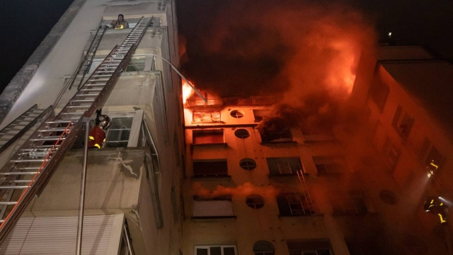 Firefighters battle a fire at a Paris apartment building.