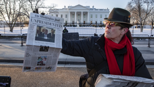 Volunteers distribute a lookalike "special edition" of The Washington Post.