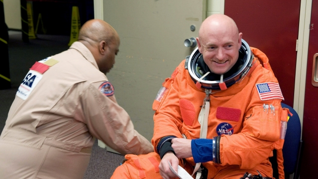 Mark Kelly, right, suited up for a NASA training exercise