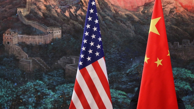 A Chinese flag and an American flag.