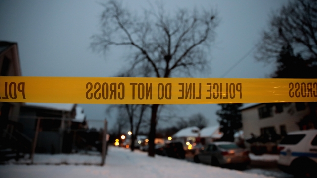 Police investigate the scene of a quadruple homicide on Chicago's South Side.
