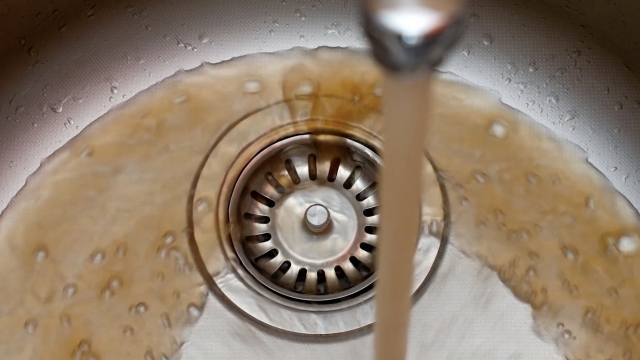 Brown water flows from faucet