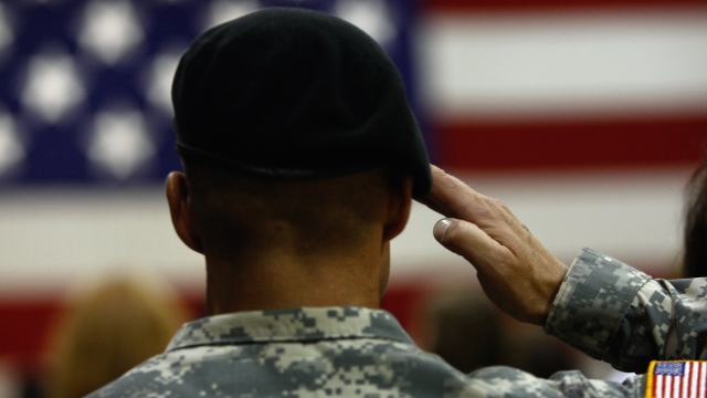 An armed services member salutes