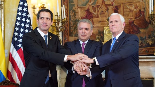 Vice President Mike Pence and Colombian President Ivan Duque shake hands with Venezuelan President Juan Guaido.