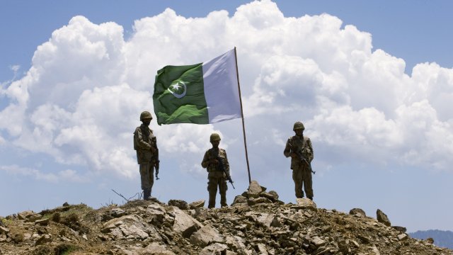 Pakistani soldiers stand guard
