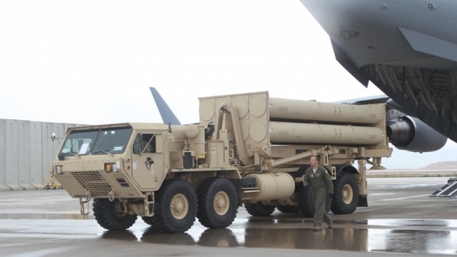 A U.S. Air Force Airmen offloads a THAAD system