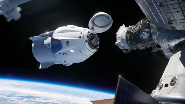 An illustration showing Crew Dragon docking with the International Space Station