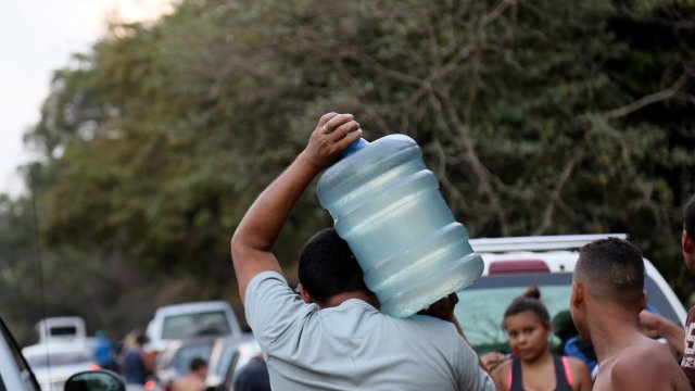 A man carrying water in Venezuela