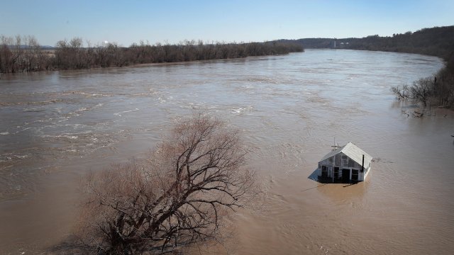 A structure is surrounded by floodwater.