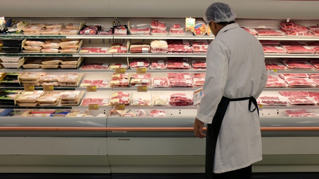 Meat is displayed in a case at a grocery store
