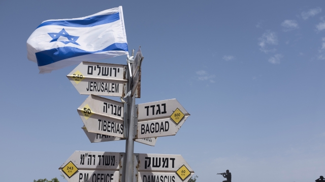 Sign in front of Golan Heights sculpture
