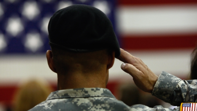 Soldier salutes during national anthem