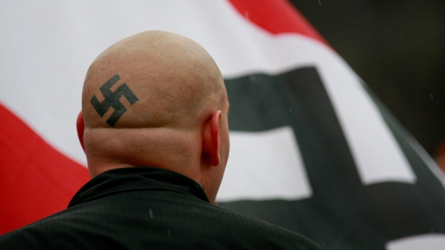Neo-Nazis protest outside Skokie Holocaust museum dedication.
