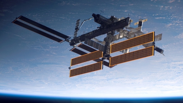The International Space Station is seen over Earth