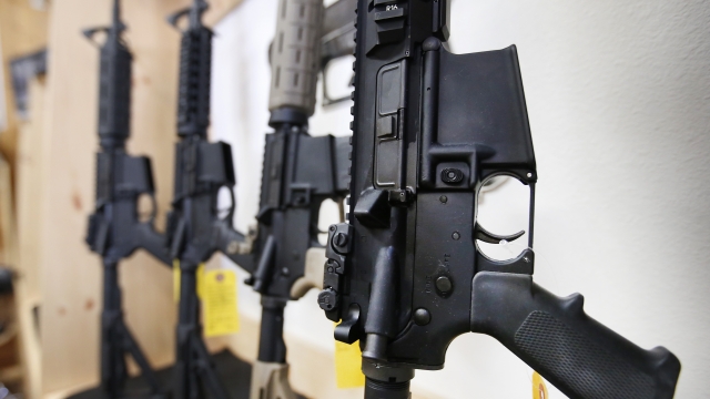 A rack of AR-15 semi-automatic guns on display