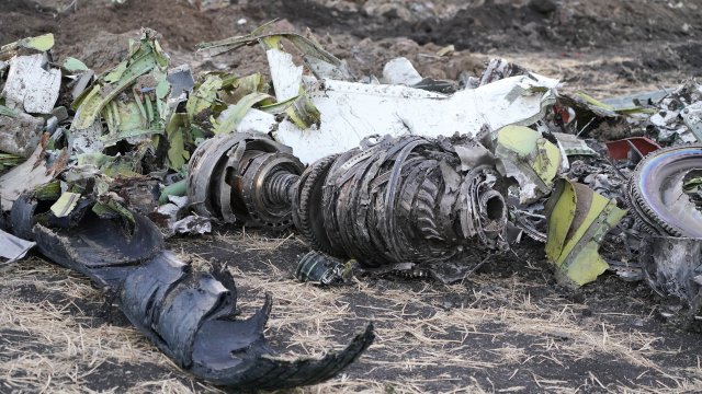 Parts of an engine and landing gear lie in a pile after the crash of Ethiopian Airlines Flight 302.