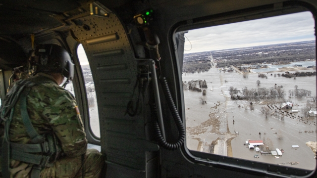 The Nebraska Army National Guard helps with flood response efforts on March 14, near Columbus, Nebraska