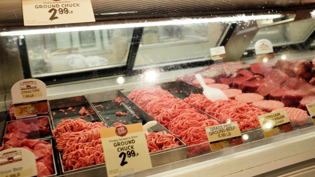Ground beef sits in a display case at a grocery store.