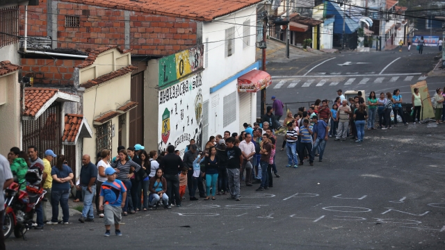 People line up to buy food in Venezuela