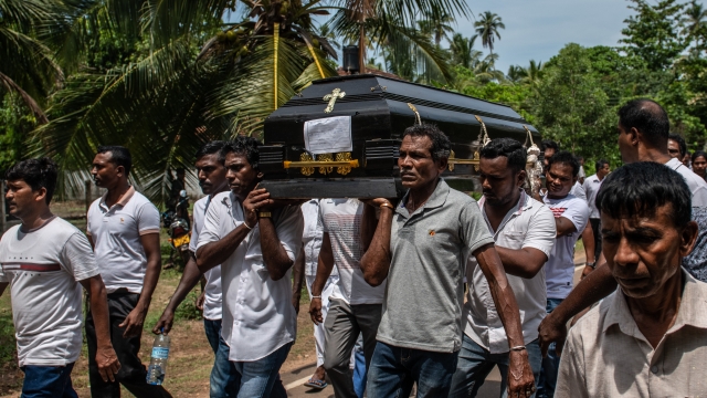 Men carrying casket