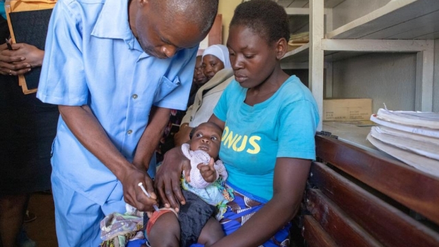 A child is given the malaria vaccine