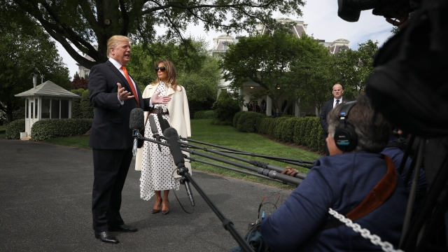 President Donald Trump and First Lady Melania Trump talk to reporters.