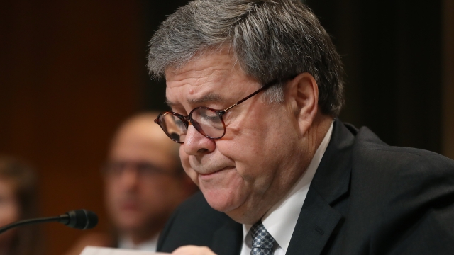 Attorney General William Barr looks over his papers while testifying before the Senate Appropriations Committee.