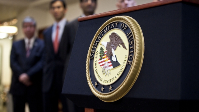 A podium with the U.S. Justice Department's seal on it