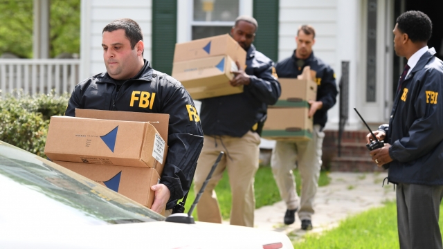 Federal agents remove items from the home of Baltimore Mayor Catherine Pugh