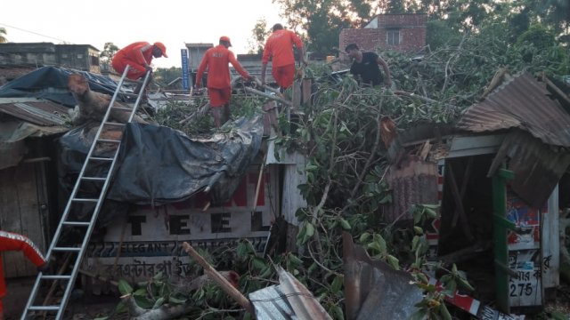 Member's of India's National Disaster Response Force wade through damage caused by Cyclone Fani.