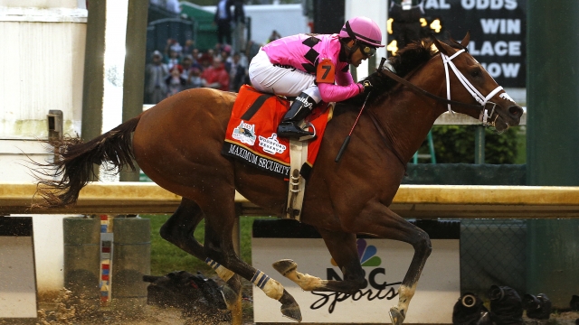 Maximum Security, ridden by jockey Luis Saez, crosses the finish line during 145th running of the Kentucky Derby.