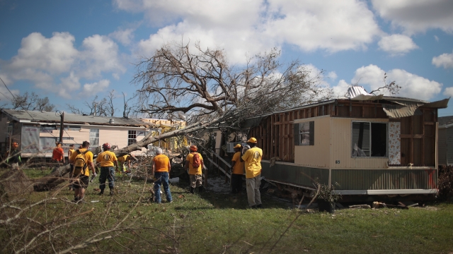 Volunteers from the Scientology Volunteer Ministers help to clear debris left by Hurricane Michael