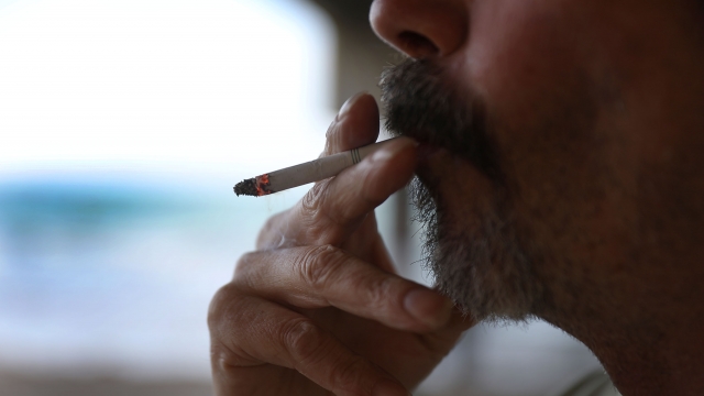 A man smoking a cigerette
